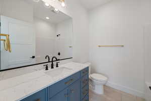 Full bathroom featuring vanity and light tile patterned floors