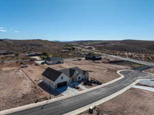 Aerial view of property and surrounding area with mountains