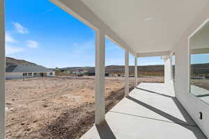 View of patio / terrace with a mountain view