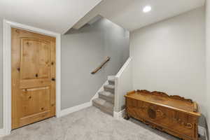 Stairs featuring carpet floors and recessed lighting