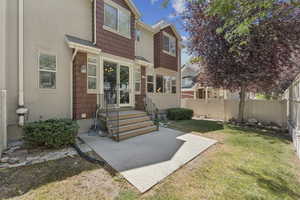 Back of house with a patio and a fenced backyard