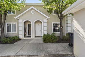 View of exterior entry featuring stucco siding