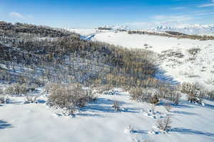 Snowy aerial view with a mountain view