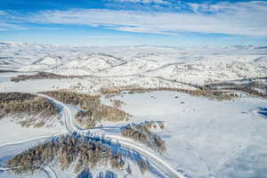 Snowy aerial view featuring a mountain view