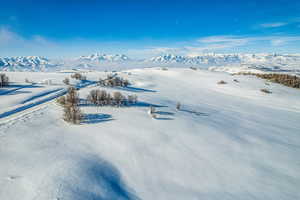Snowy aerial view with a mountain view