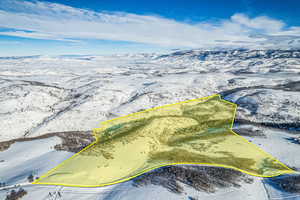 Snowy aerial view with property boundaries highlighted