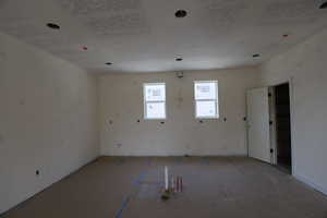 Spare room featuring baseboards