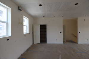 Spare room featuring baseboards