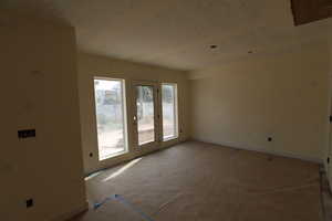 Empty room featuring baseboards