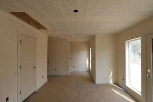 Empty room featuring baseboards