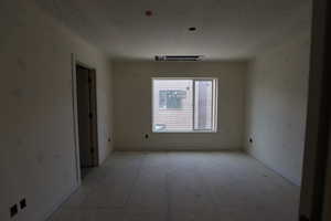 Unfurnished room featuring baseboards