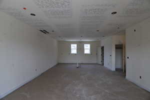 Unfurnished room with baseboards