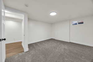 Basement with carpet flooring and baseboards
