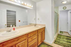Primary bathroom with double vanity, walk in shower with duel shower heads,  separate toilet room and huge walk in closet.