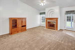 Family room with vaulted ceiling and gas fireplace.