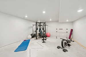 Exercise room with recessed lighting and recessed fan