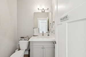 Bathroom featuring vanity and toilet