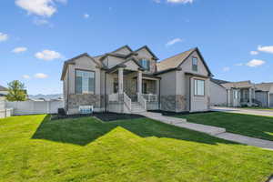 Craftsman house with stone siding and covered porch