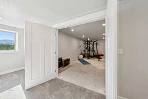 Workout room featuring recessed lighting