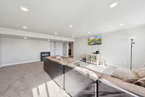 Living area featuring carpet floors and recessed lighting