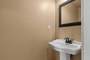 Powder 1/2 bathroom with a sink