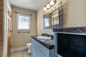 Bathroom featuring vanity and light tile patterned floors