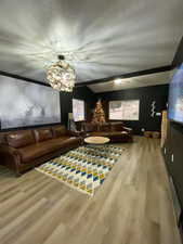 Living area with wood finished floors and a textured ceiling