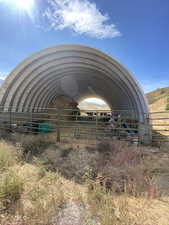 View of yard with an outdoor structure and an exterior structure