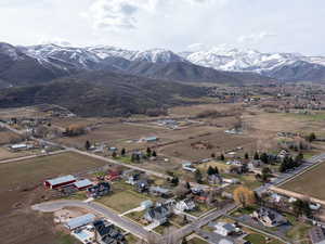 Aerial view of property's location with a mountain backdrop