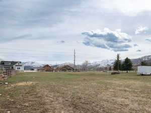 View of yard featuring a mountain view and a rural view