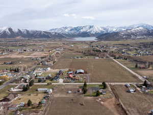 Aerial view of property's location with a water and mountain view