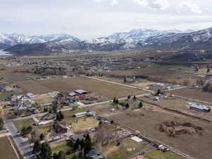 Aerial view of sparsely populated area with a mountain backdrop