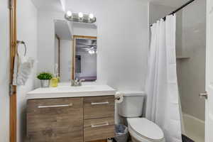 Bathroom featuring vanity and shower / bath combo