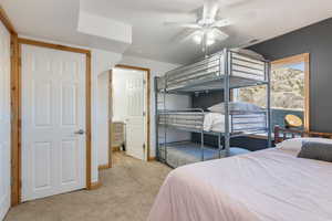 Bedroom featuring light colored carpet and ceiling fan