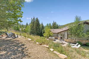View of yard with a patio area and a fire pit