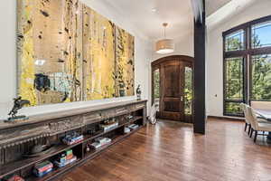 Foyer entrance featuring hardwood / wood-style floors and baseboards
