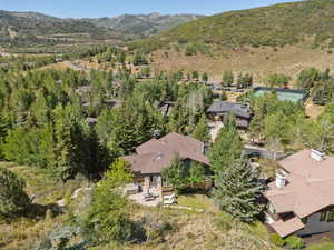 Aerial view of property's location with a mountainous background