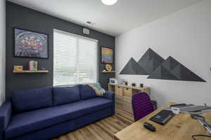 Office with wood finished floors