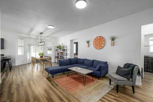 Living area with plenty of natural light and light wood-type flooring