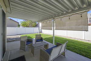 Fenced backyard featuring a patio