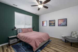 Bedroom featuring wood finished floors and ceiling fan