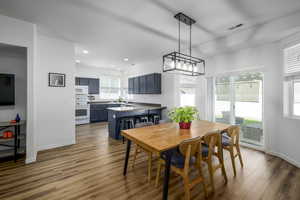 Dining area featuring light wood-style floors and recessed lighting