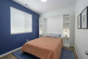 Bedroom featuring wood finished floors