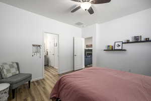 Bedroom featuring wood finished floors and a ceiling fan