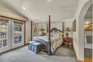 Bedroom with vaulted ceiling, access to outside, carpet floors, and recessed lighting