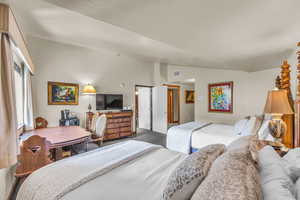 Bedroom with vaulted ceiling