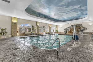 Indoor pool featuring a patio area