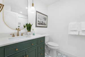 Bathroom featuring vanity and recessed lighting