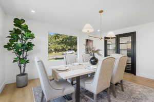 Dining room featuring light wood-style floors and recessed lighting