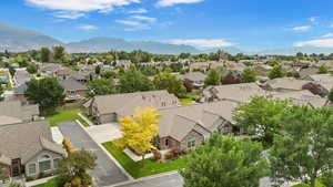 Aerial perspective of suburban area with a mountain backdrop